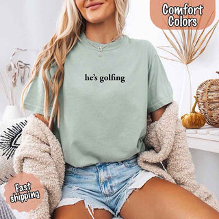 He’s Golfing Comfort Colors Shirt – Funny Girlfriend or Wife Tee - A Roese Boutique