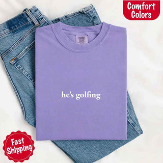He’s Golfing Comfort Colors Shirt – Funny Girlfriend or Wife Tee - A Roese Boutique