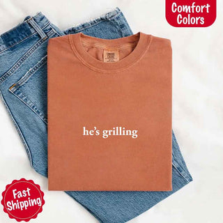 He’s Grilling – Funny Summer BBQ Comfort Color Shirt for Women - A Roese Boutique