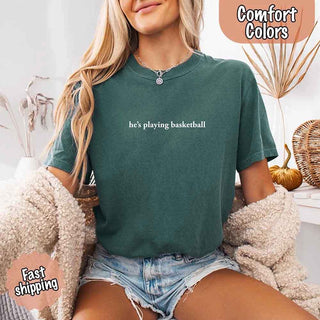 He’s Playing Basketball – Funny Sports Girlfriend Comfort Color Shirt for Women - A Roese Boutique