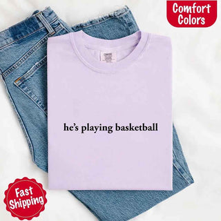 He’s Playing Basketball – Funny Sports Girlfriend Comfort Color Shirt for Women - A Roese Boutique