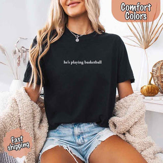 He’s Playing Basketball – Funny Sports Girlfriend Comfort Color Shirt for Women - A Roese Boutique