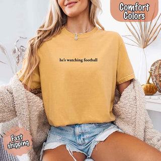 He’s Watching Football Tee - Comfort Colors Funny Shirt for Her - A Roese Boutique